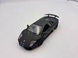 Black pull-back diecast sports car toy, front three-quarter view