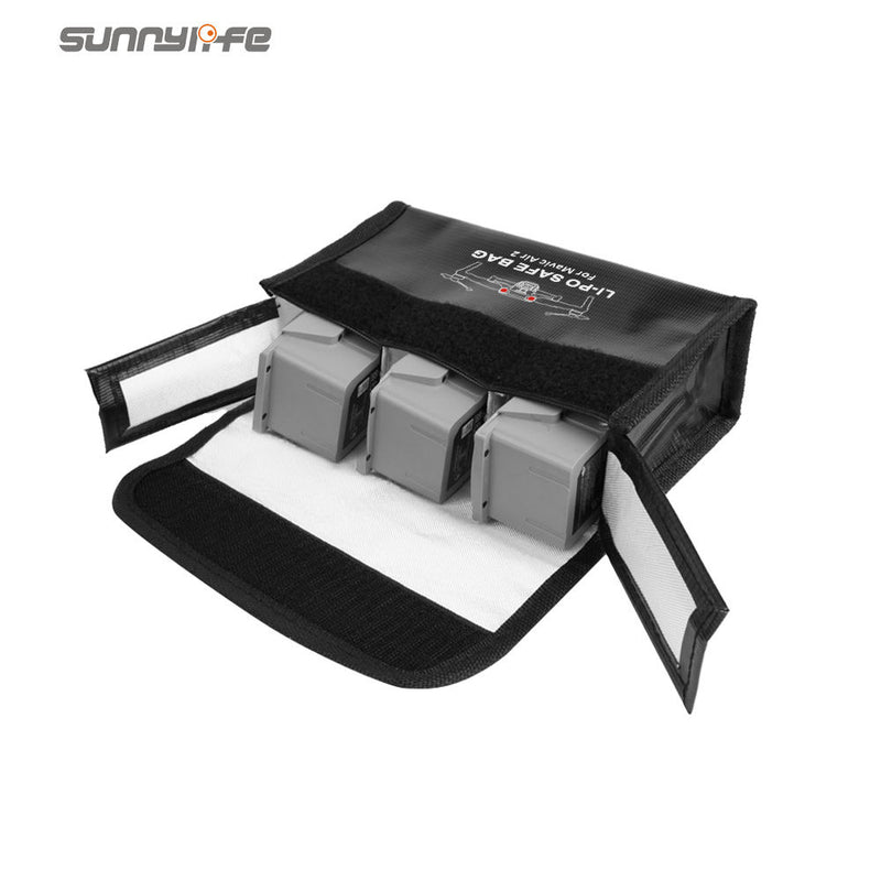 Black battery storage bag, open with three battery slots and covers.
