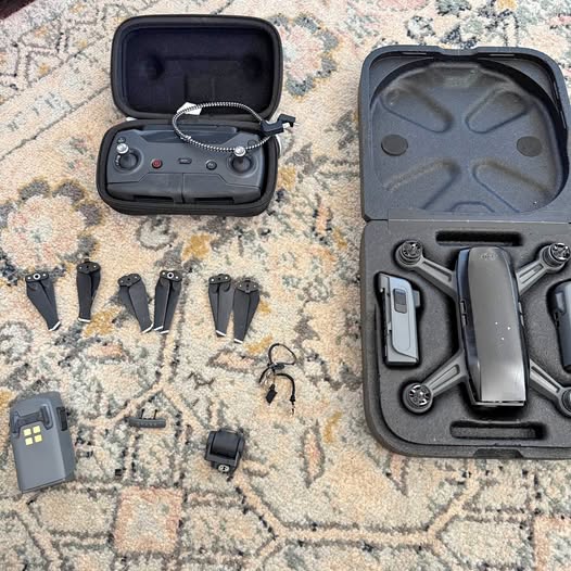 DJI Spark drone bundle in hard case with controller, extra batteries, and propellers