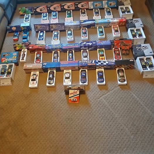 NASCAR diecast car collection, multiple boxed race car models
