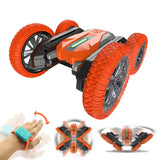RC 4WD drift car with orange tread tires and black body, with wrist remote control