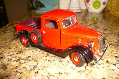 Diecast 1937 Ford pickup truck, gloss red, front 3/4 view