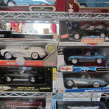 Diecast car assortment in a boxed retail display, multiple models visible