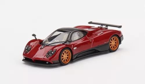 Red diecast sports car model with black hood and rear wing, orange wheels