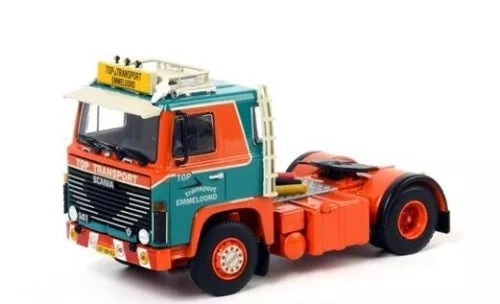 Orange and teal diecast model truck cab with black grille and chrome details