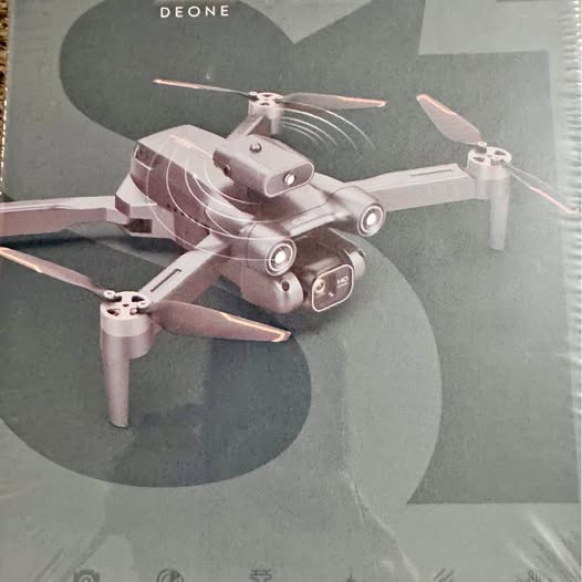 Gray quadcopter drone with camera gimbal and four propellers