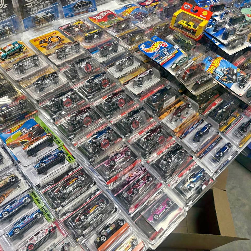 Diecast car collection in clear blister packs, assorted vehicles and colors