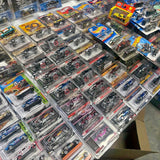 Diecast car collection in clear blister packs, assorted vehicles and colors