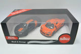 Die-cast car set in retail box, black and orange cars with glossy finish