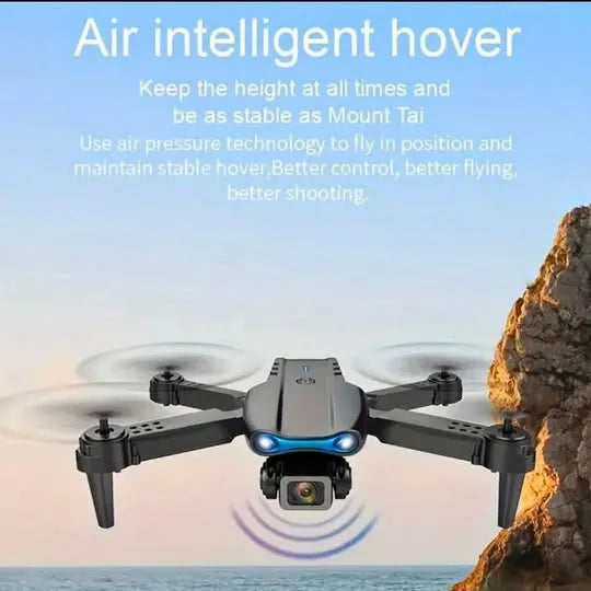 Gray quadcopter drone with front camera and four propellers