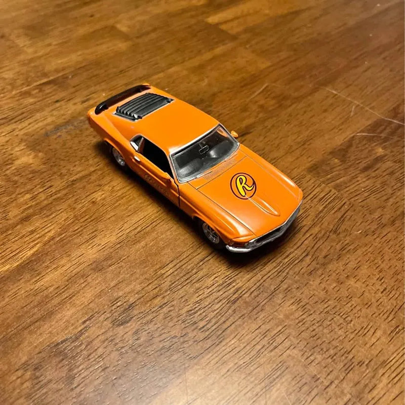 Orange 1970 Ford Mustang diecast model car, black hood stripes