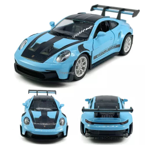 Blue and black diecast model sports car with rear spoiler and detailed headlights