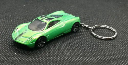 Green diecast car keyring with metal ring and detailed sports car body