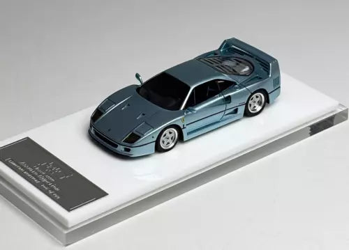 Light blue 1:64 racing diecast car model, front three-quarter view