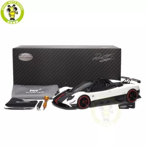 White and black 1/18 diecast roadster model car with display packaging