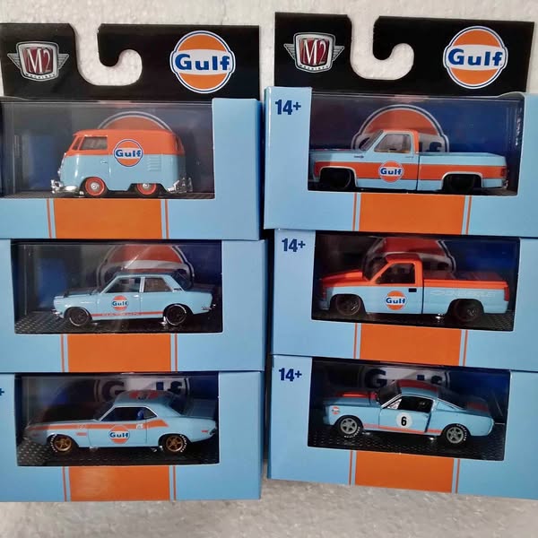 Diecast car set in retail boxes, Gulf-themed orange and white cars