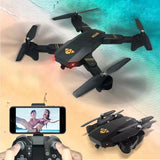 Foldable quadcopter drone with four propellers, black body and FPV camera