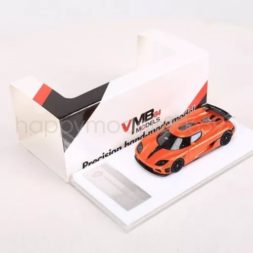 Orange racing diecast car model with black accents in display tray