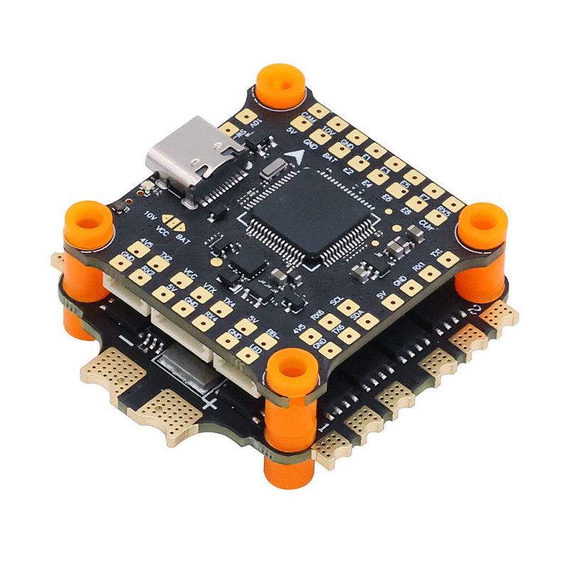FPV drone flight controller and ESC stack circuit board with orange mounting standoffs