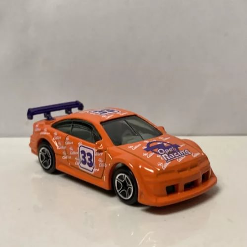 Opel Calibra DTM 1/64 diecast race car, orange with rear wing and number 33