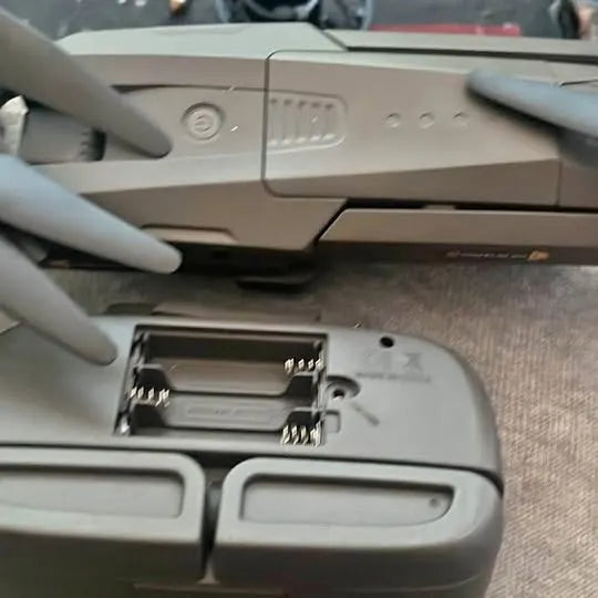 Gray drone body with front landing gear and mounting bracket details