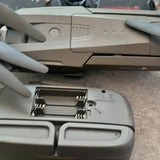 Gray drone body with front landing gear and mounting bracket details