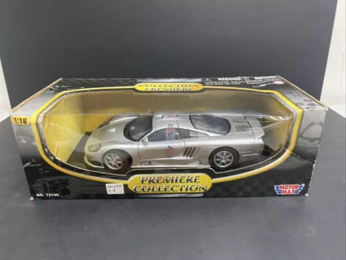 1:18 silver diecast model car in display box with clear cover