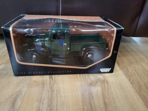 1:24 scale diecast 1941 Plymouth pickup truck, green, in display box