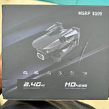 Silver quadcopter drone with dual camera on retail box