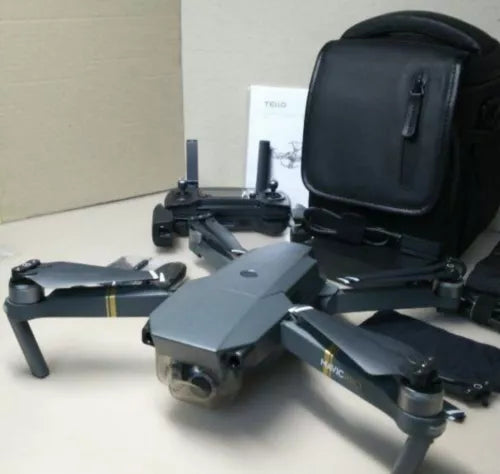 Gray quadcopter drone with extended arms and front camera