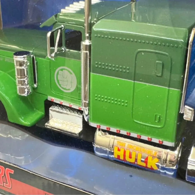 Green diecast model Peterbilt truck with chrome details and Hulk logo on side
