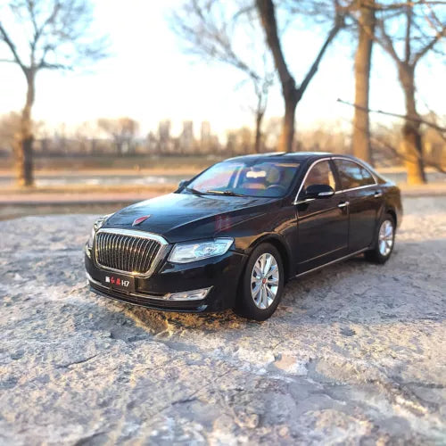 Black 1:18 scale sedan diecast model car, front three-quarter view