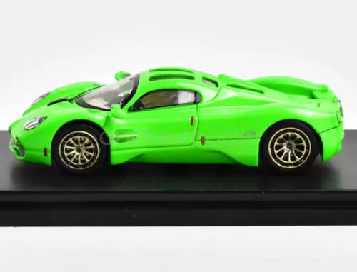 Green racing sports diecast metal car, side profile with black wheels