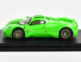 Green racing sports diecast metal car, side profile with black wheels