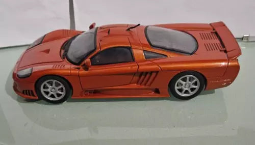 Saleen S7 metallic orange diecast sports car model, silver wheels and rear spoiler