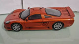 Saleen S7 metallic orange diecast sports car model, silver wheels and rear spoiler