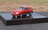 Red diecast model car on black display base, front three-quarter view.