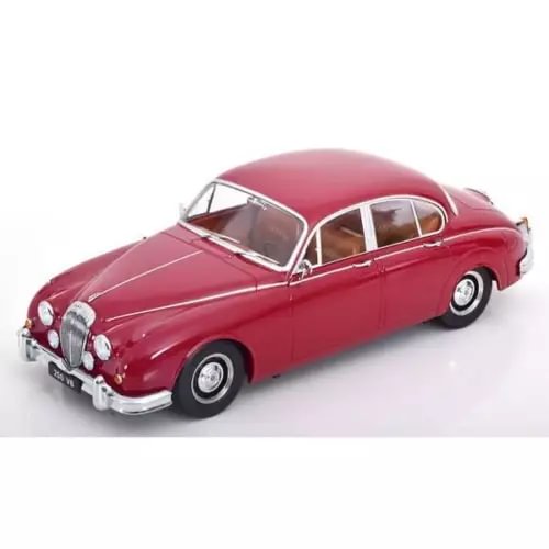 Red diecast mini car, chrome grille and headlights, front three-quarter view.