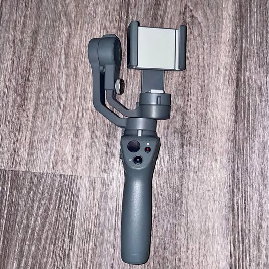 DJI Osmo Mobile 2 gimbal stabilizer with smartphone clamp, dark gray
