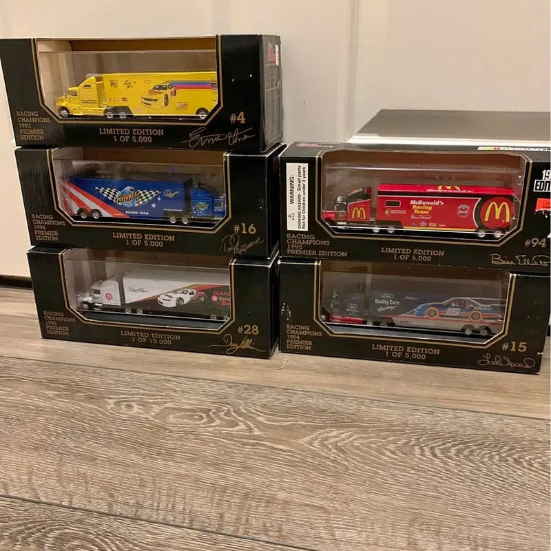 Boxed diecast truck set with multiple limited-edition cars in cases