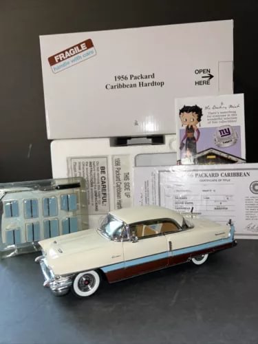 Light cream and blue 1956 Packard Caribbean hardtop diecast car with red stripe
