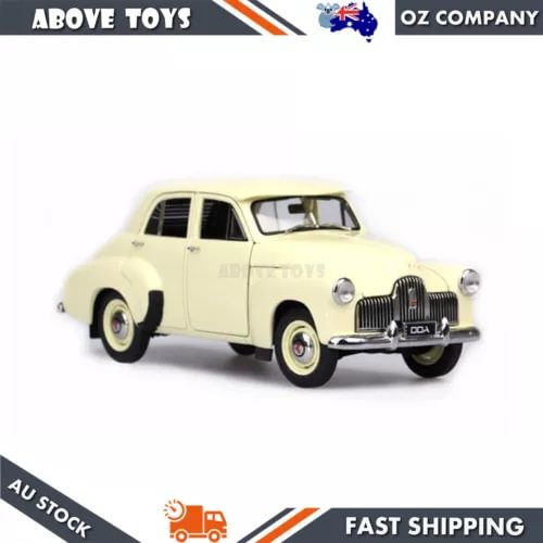 Cream 1:24 scale diecast sedan model, front three-quarter view, detailed grille