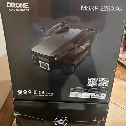 Foldable quadcopter drone with front camera, dark gray body and blue status light