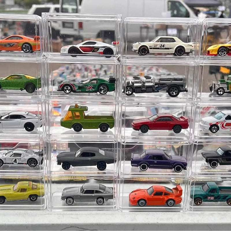 Hot Wheels diecast cars in clear plastic organizer, multiple vehicle styles visible