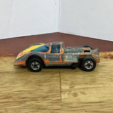 Hot Wheels diecast race car with gray body, orange and yellow decals, black wheels