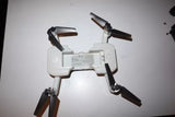 Quadcopter drone main body with four propeller arms and rear label
