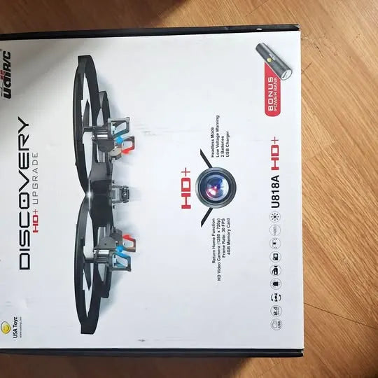 Discovery HD+ drone in retail box, front view with landing gear and propellers visible