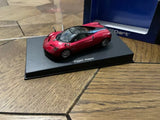 AUTOart red diecast model sports car on black display base, front 3/4 view