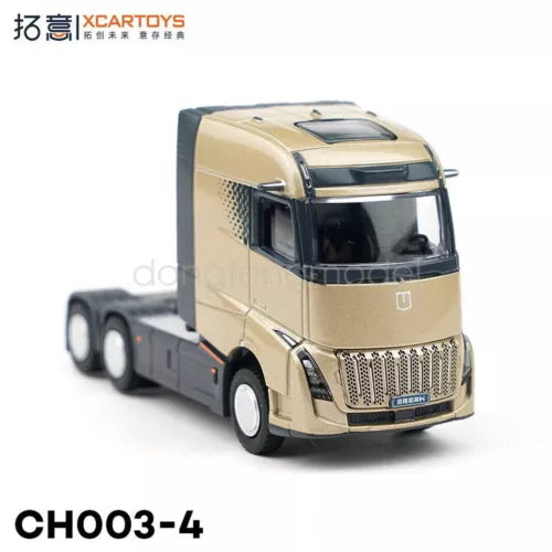 Gold diecast tractor truck model with black windshield and detailed front grille