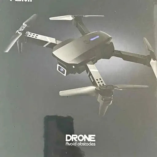 Grey quadcopter drone with four arms and spinning propellers